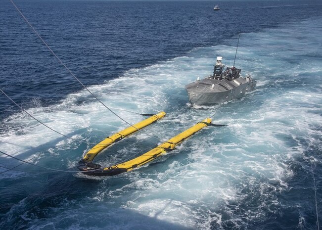 The Mine Countermeasures Unmanned Surface Vehicle (MCM USV) in Minehunt configuration performs launch and recovery operations during Initial Operational Test and Evaluation (IOT&E) in August 2022