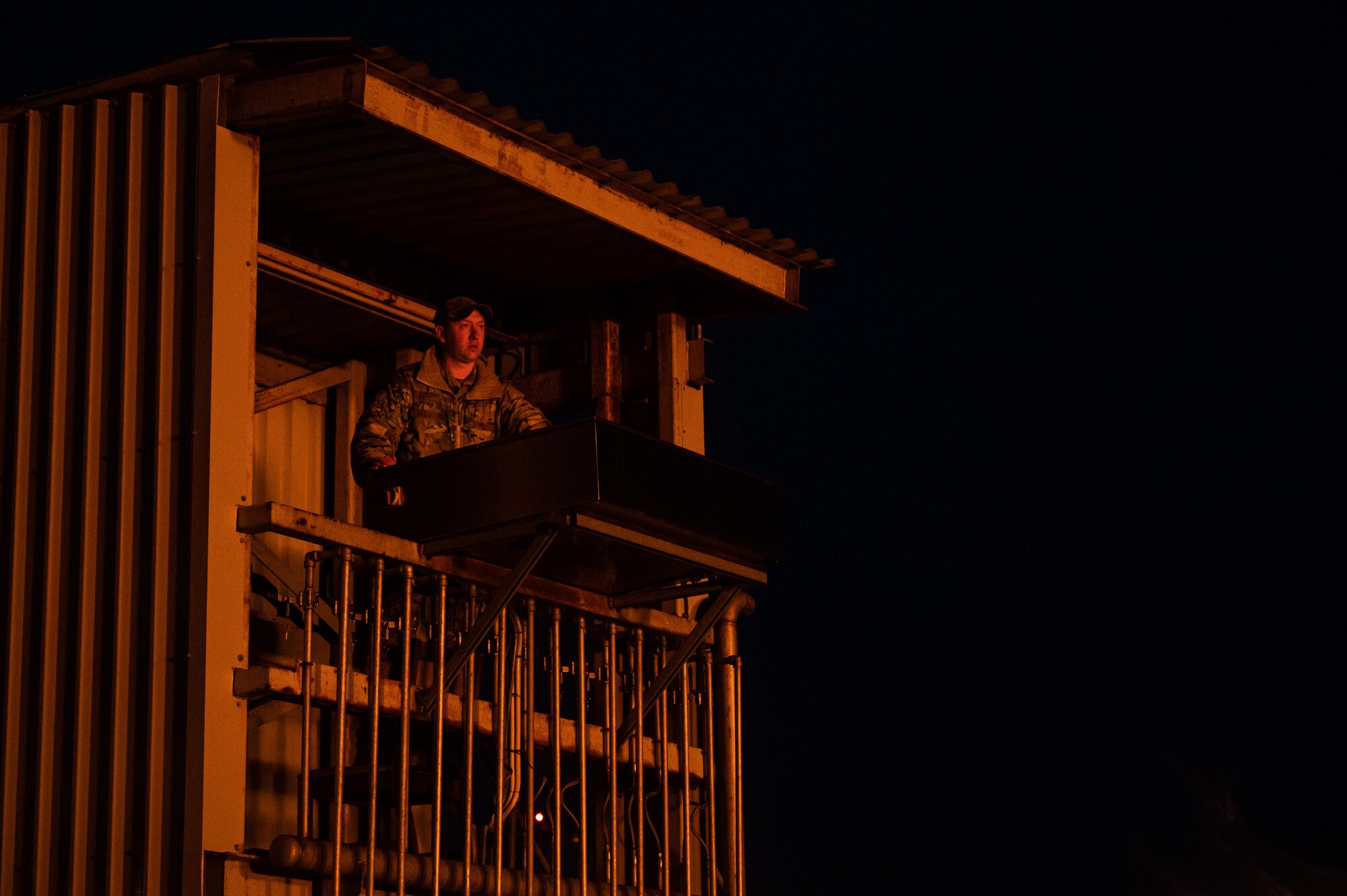 U.S. Air Force Tech. Sgt. Victor Hallett, 100th Civil Engineer Squadron non-commissioned officer in charge of logistics and member of the wing inspection team, tests the functions of the live fire trainer during a base-wide exercise at Royal Air Force Mildenhall, England, April 27, 2023.