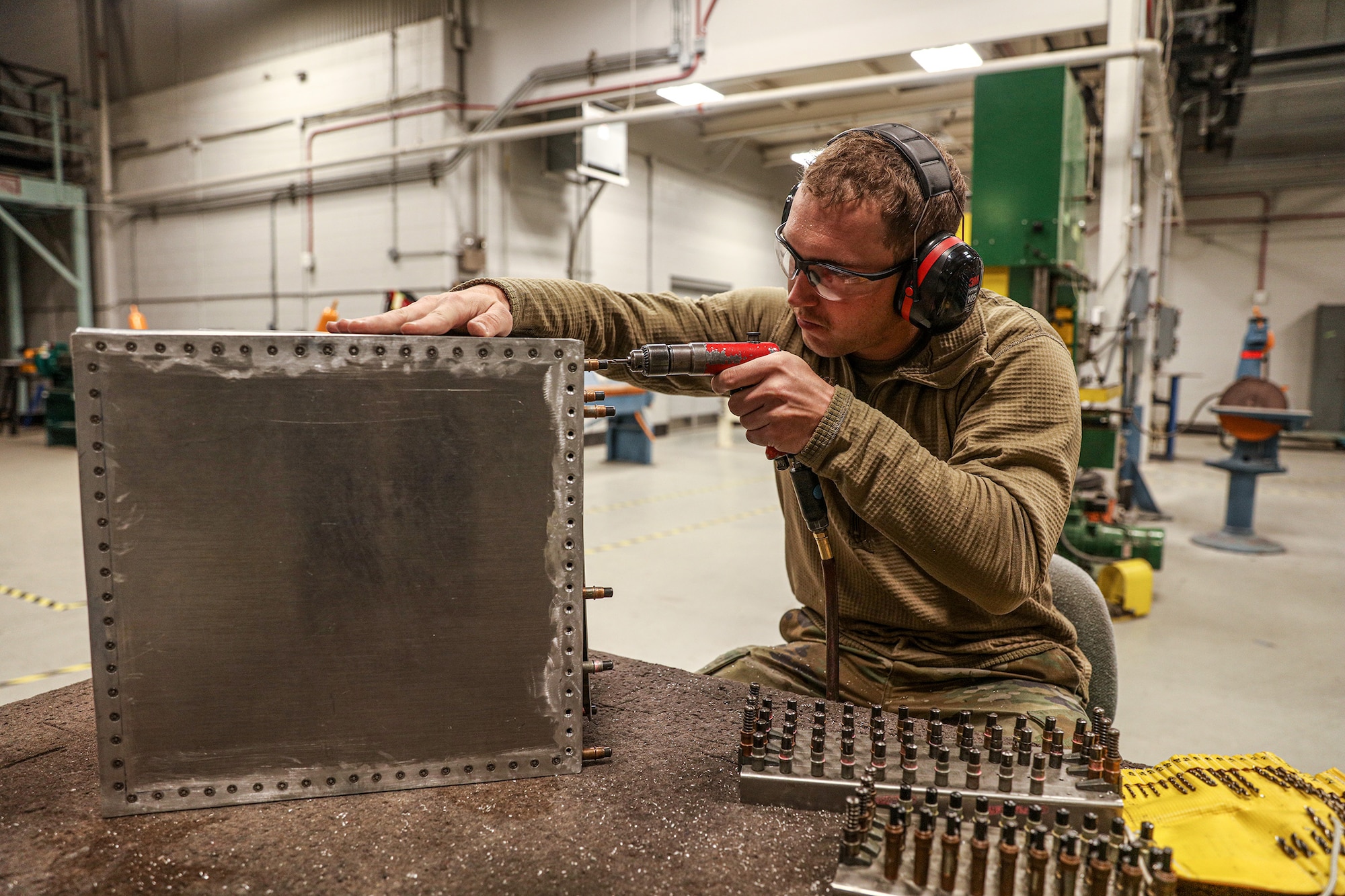 Senior Airman Nathan Rosenbauer, 445th Maintenance Squadron Fabrication Flight aircraft structural maintenance apprentice, drills into a sheet metal box to complete a task for his 5-level training at Wright-Patterson Air Force Base, Ohio, April 19, 2023. The 445th Maintenance Squadron Fabrication Flight won Maintenance Section of the Year in the 2022 annual Chief Master Sgt. of the Air Force Thomas N. Barnes, Armament Systems, Munitions and Major Command Unit Awards.