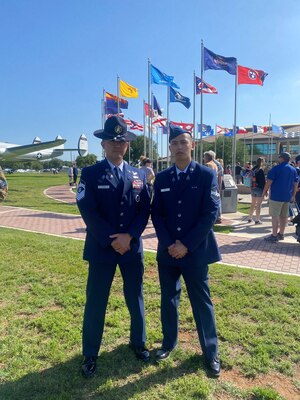 U.S. Space Force Senior Master Sgt. Anthony Chua, 1st Delta Operations Squadron, Detachment 1 senior enlisted leader, left, and his son, U.S. Space Force Spc. 3 Anthony "AJ" Chua, right, pose for a photo following AJ's graduation from U.S. Space Force Basic Military Training at Lackland Air Force Base, Texas, April 26, 2023. AJ is following in his father's footsteps of serving in the Space Force, enlisting as a cyber operations specialist. (Courtesy photo)