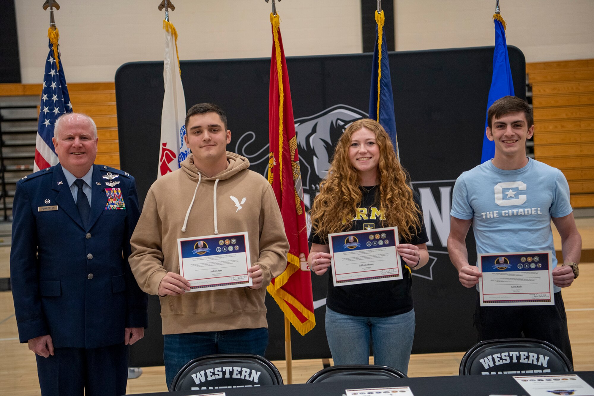 Col. Thom Pemberton, 434th Air Refueling Wing commander poses with students from Western High School during a military signing day event held April 27, 2023. The students have opted to join the military after graduation. and become the next generation of citizen warriors. (U.S. Air Force photo/TSgt. Jami Lancette)