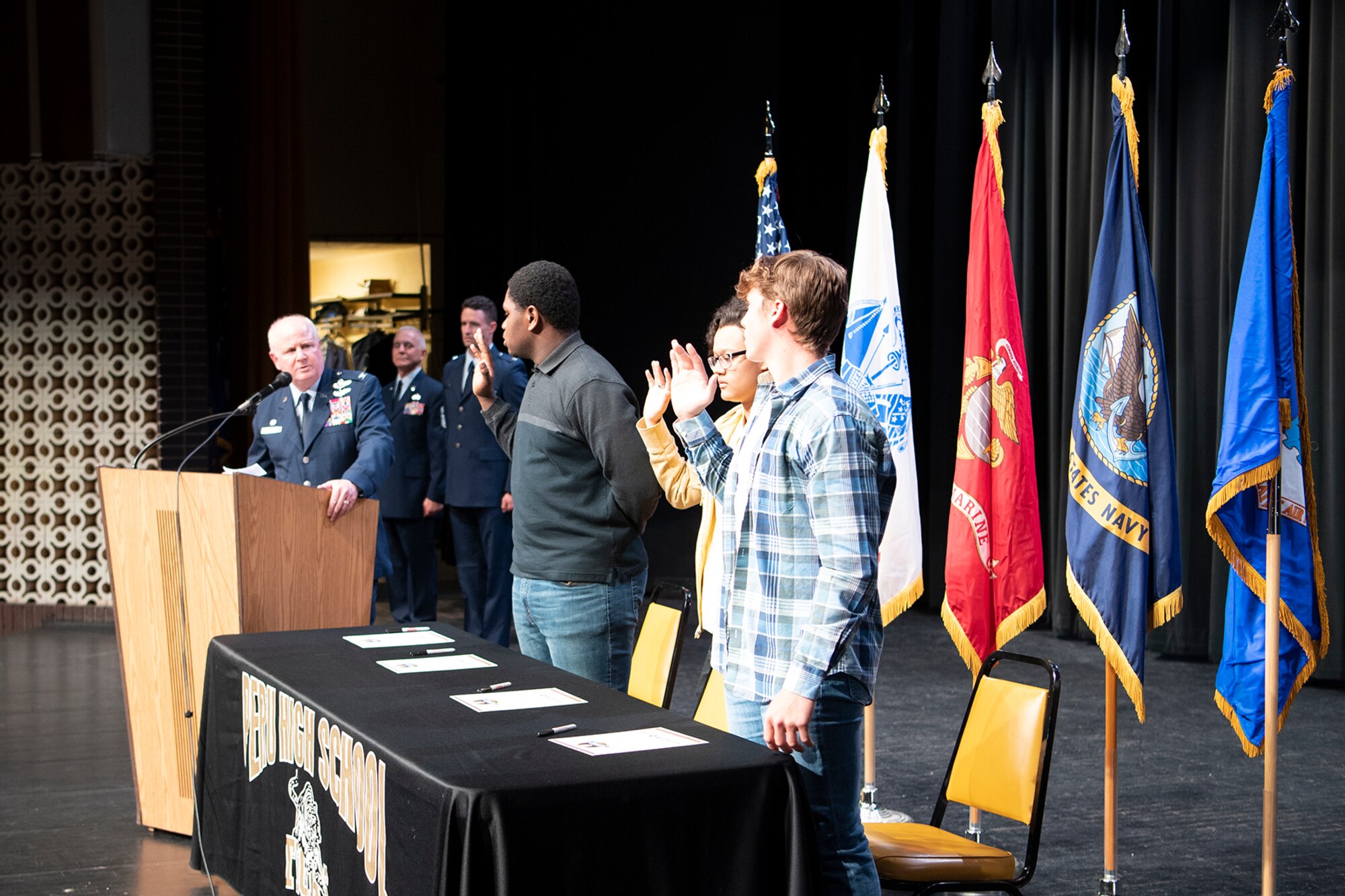 Col. Thom Pemberton, 434th Air Refueling Wing commander, administers the oath of enlistment to military signees during a Peru High School military signing day event May 1. Schools from both Peru and Kokomo held events to recognize the next generation of citizen warriors. (U.S. Air Force photo/TSgt. Jami Lancette)