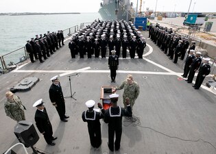 Sailors take the Oath of Allegiance during a naturalization ceremony aboard USS Arleigh Burke (DDG 51).