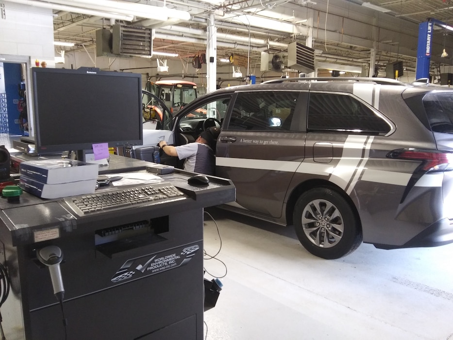 A rideshare van undergoes air emissions testing at the Hill Air Force Base Auto Hobby Shop in Utah.