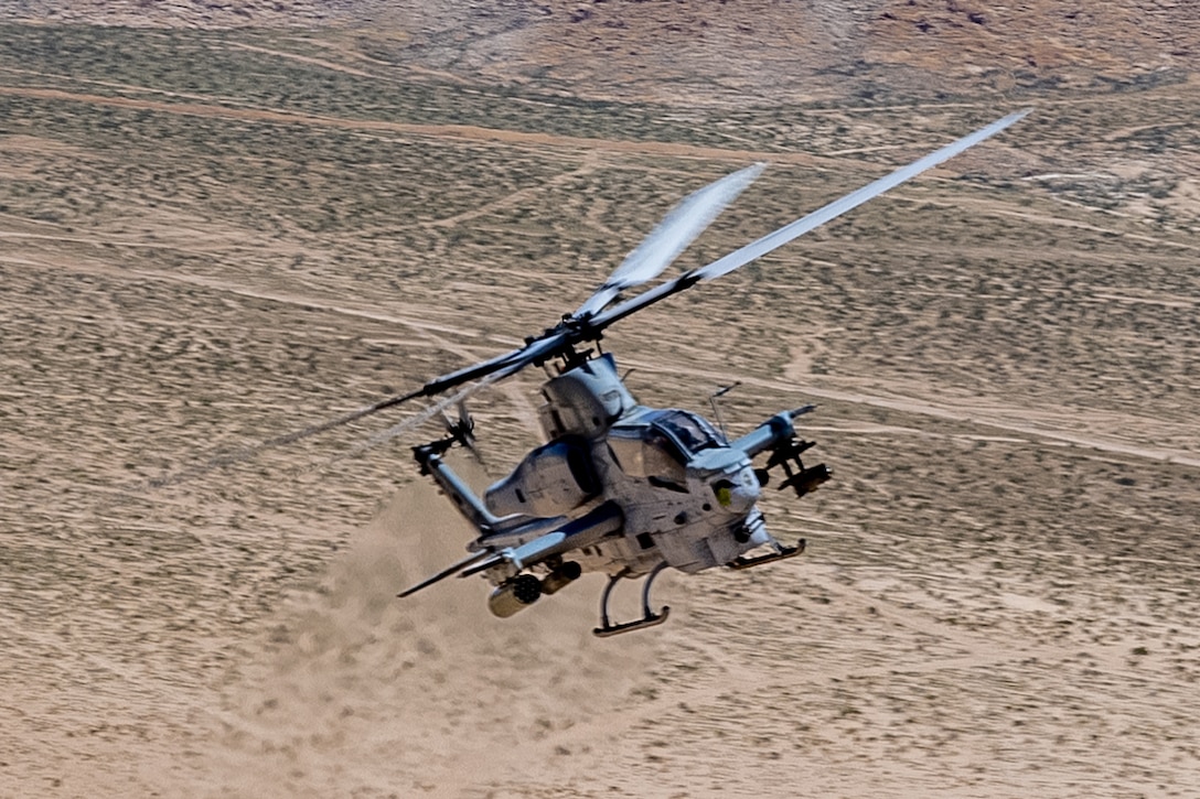 A U.S. Marine Corps AH-1Z Viper with Marine Light Attack Helicopter Squadron (HMLA) 367, Marine Aircraft Group 39, 3rd Marine Aircraft Wing, conducts training during National Training Center Rotation 23-07 at Fort Irwin, California, April 27, 2023. During the exercise, HMLA-367 supported 75th Ranger Regiment and 3/160th Special Operations Aviation Regiment (SOAR) as the sole rotary-wing fire support element, enhancing joint planning and execution of long-range assault force escort, deep and close air support, and direct-action raids. (U.S. Marine Corps photo by Lance Cpl.  Devereux)