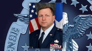 A portrait of Air Force Maj. Gen. Mark Johnson on a DLA emblem background