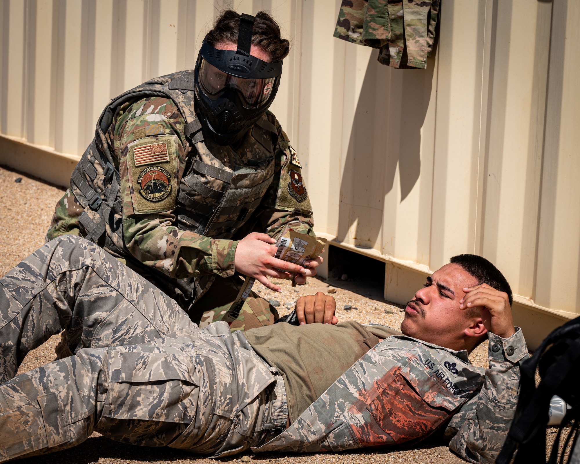U.S. Air Force Tech. Sgt. Kaylee Simmers, 56th Medical Group family health clinic flight chief, provides Tactical Combat Casualty Care to a simulated patient during an exercise April 26, 2023, at Luke Air Force Base, Arizona.