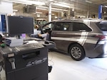 A rideshare van undergoes air emissions testing at the Hill Air Force Base Auto Hobby Shop in Utah.
