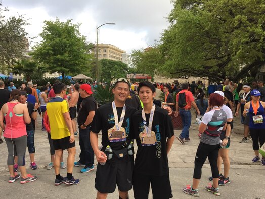  U.S. Space Force Senior Master Sgt. Anthony Chua, 1st Delta Operations Squadron, Detachment 1 senior enlisted leader, left, and his son, U.S. Space Force Spc. 3 Anthony "AJ" Chua, right, pose for a photo following a race in San Antonio, Texas. AJ recently graduated from U.S. Space Force Basic Military Training, following in his father's footsteps of serving in the Space Force. (Courtesy photo)