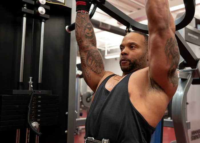 U.S. Air Force Master Sgt. Michael Joyner, 355th Force Support Squadron fitness flight section chief, works out in the Haeffner Fitness Center at Davis-Monthan Air Force Base, Ariz., April 25, 2023. Joyner trains often to compete in men’s physique competitions. (U.S. Air Force photo by Airman William Finn)
