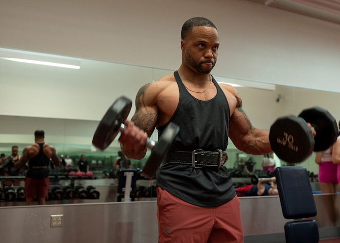 U.S. Air Force Master Sgt. Michael Joyner, 355th Force Support Squadron fitness flight section chief, performs bicep curls in the Haeffner Fitness Center at Davis-Monthan Air Force Base, Ariz., April 25, 2023. Joyner competed in his first men’s physique competition in June of 2022, finishing in second place. (U.S. Air Force photo by Airman William Finn)