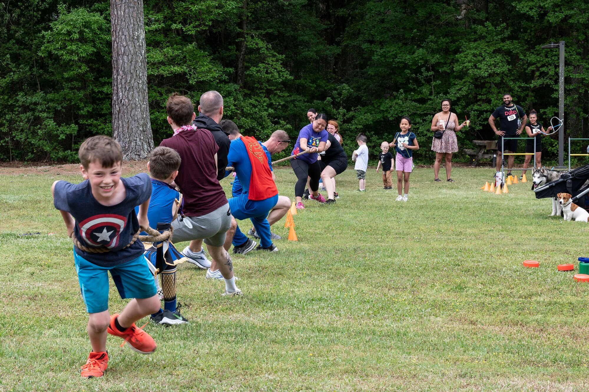 Children and their families participate in tug-of-war competition during a 5-kilometer walk and run event in observation of the Month of the Military Child at Seymour Johnson Air Force Base, North Carolina, April 22, 2023. Games and food were available for attendees, who were encouraged to dress in their favorite princess or superhero costume during the festivities. The event served as an opportunity for members of Seymour Johnson AFB to give back to military-connected children and recognize them for the role they play in the base community.