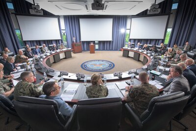 Defense Logistics Agency and Marine Corps leaders meet in large conference room.