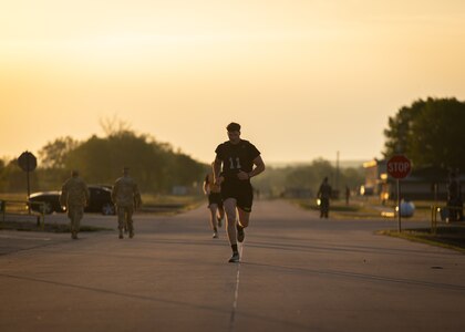 Spc. Carson Downum, a horizontal construction engineer assigned to the 2120th Engineer Company, 120th Engineer Battalion, 90th Troop Command, Oklahoma Army National Guard, finishes the two-mile run during the Army Combat Fitness Test, the first event of the Best Warrior Competition held at Camp Gruber Training Center, April 21, 2023. The annual competition brings Soldiers together to demonstrate their proficiency in a variety of warrior tasks and drills such as land navigation, marksmanship, an obstacle course, and a 12-mile ruck march, all culminating in an interview with a panel of sergeants major. (Oklahoma National Guard photo by Spc. Danielle Rayon)