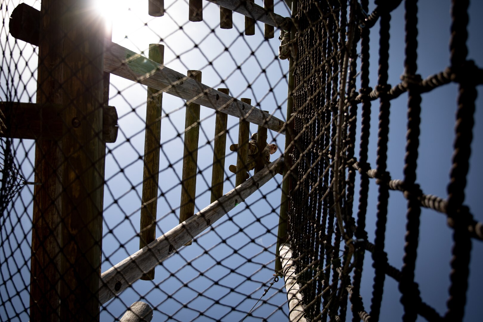 Spc. Matthew Giudice II, a fire fighter assigned to Camp Gruber Training Center, Oklahoma Army National Guard, climbs a ladder on the Tough One obstacle during the Best Warrior Competition held at Camp Gruber Training Center, April 21, 2023. The annual competition brings Soldiers together to demonstrate their proficiency in a variety of warrior tasks and drills such as land navigation, marksmanship, an obstacle course, and a 12-mile ruck march, all culminating in an interview with a panel of sergeants major. (Oklahoma National Guard photo by Spc. Danielle Rayon)