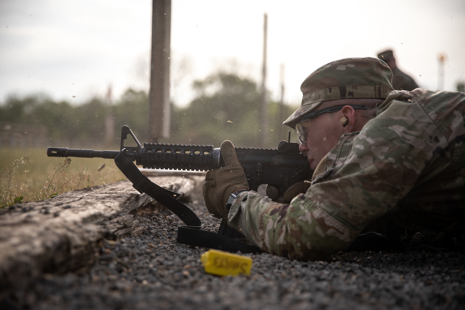 Spc. James Clark, a fire control specialist assigned to 1st Battalion, 160th Field Artillery Regiment, shoots an M4 carbine in a marksmanship challenge during the Best Warrior Competition at Camp Gruber Training Center, Oklahoma, April 22, 2023. The annual competition brings Soldiers together to demonstrate their proficiency in a variety of warrior tasks and drills such as land navigation, marksmanship, an obstacle course, and a 12-mile ruck march, all culminating in an interview with a panel of sergeants major. (Oklahoma National Guard photo by Spc. Danielle Rayon)
