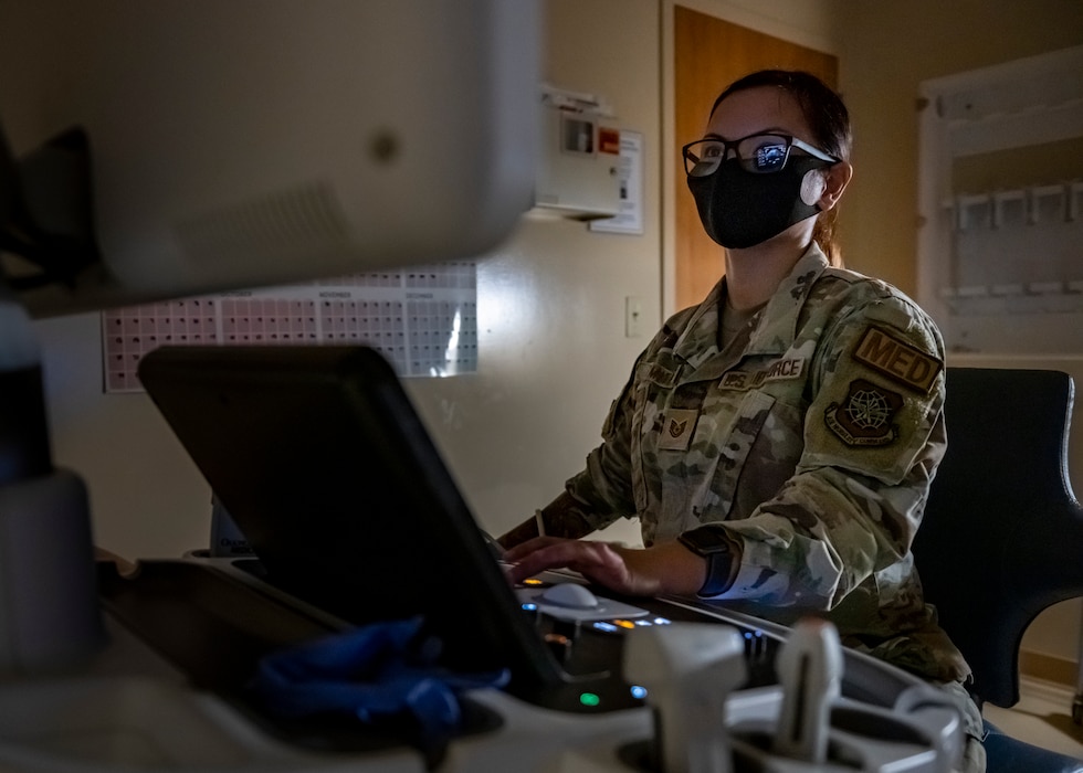 Image of an Airman working on a computer.