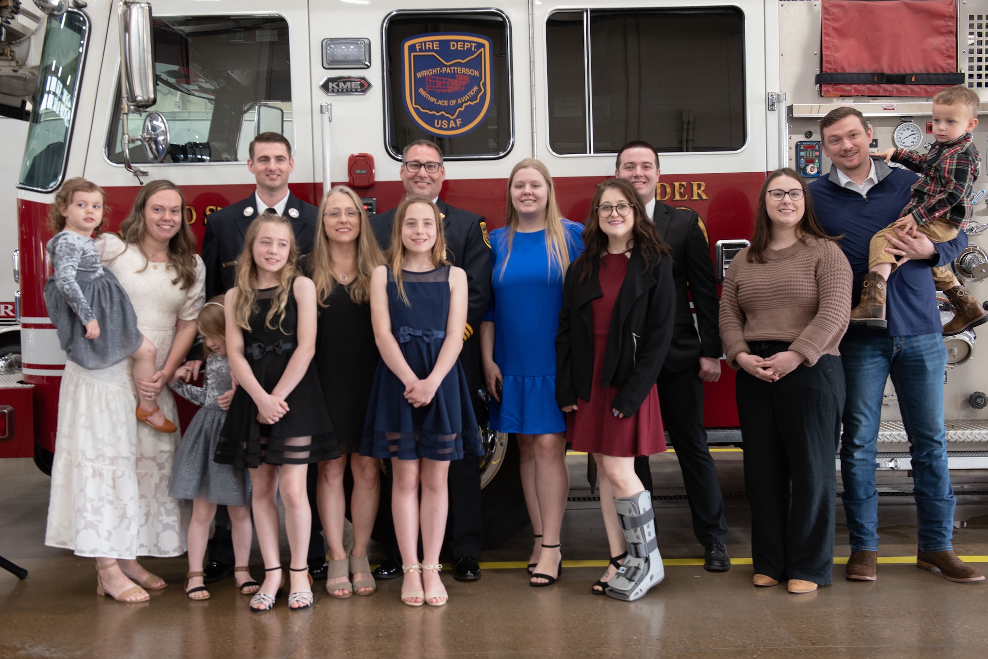 Jacob King, WPAFB fire chief, and his family stand together as they celebrate King’s career April 28, 2023, at Wright-Patterson Air Force Base, Ohio. The WPAFB Fire Department celebrated as King retired after a 27-year civil service career. (U.S. Air Force photo by Darrius Parker)