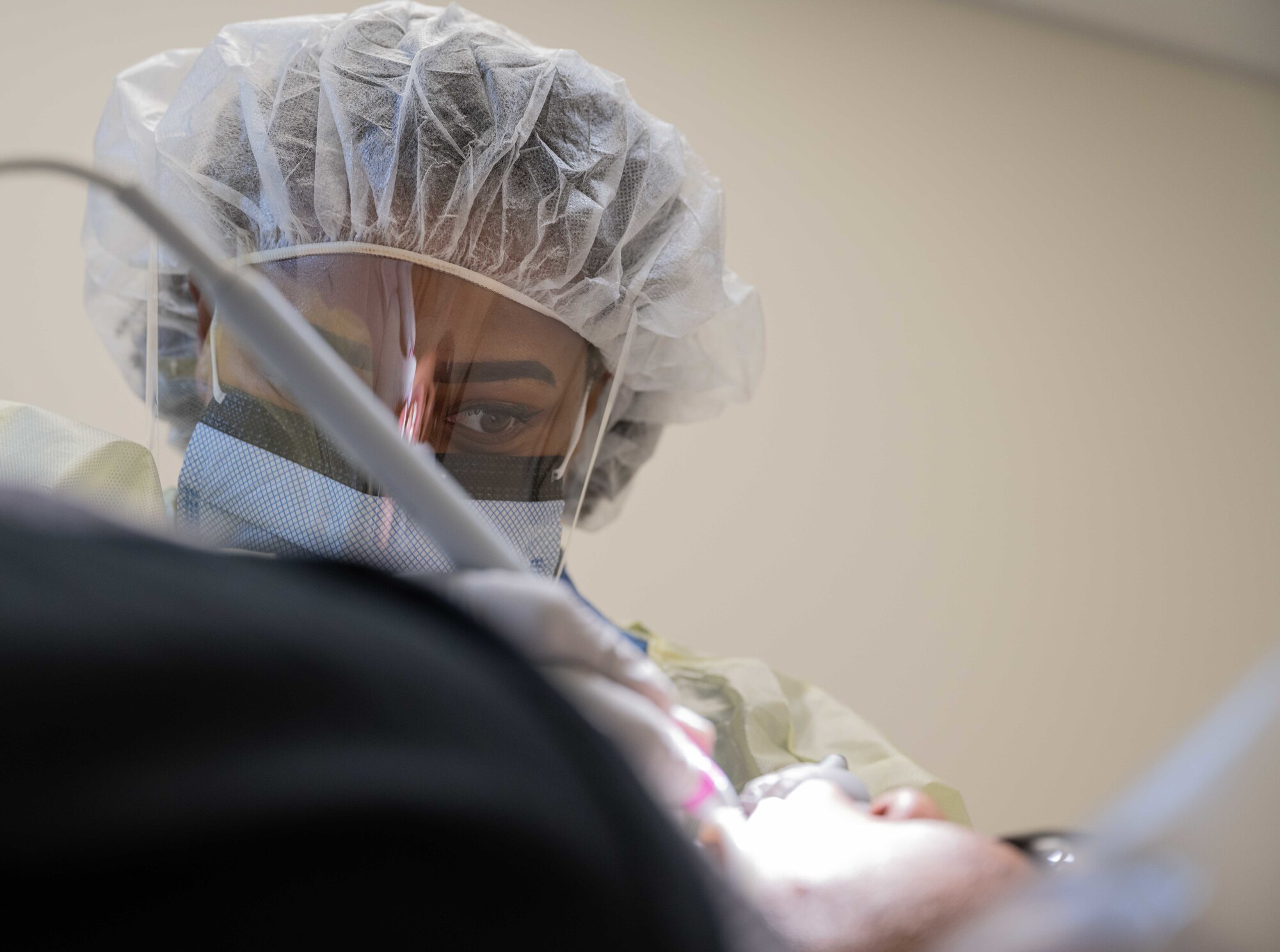 U.S. Air Force Staff Sgt. Imani Bryant, 509th Operational Medical Readiness Squadron dental assistant, conducts a routine dental cleaning on a patient at the dental clinic on Whiteman Air Force Base, Mo. on June 27, 2022.