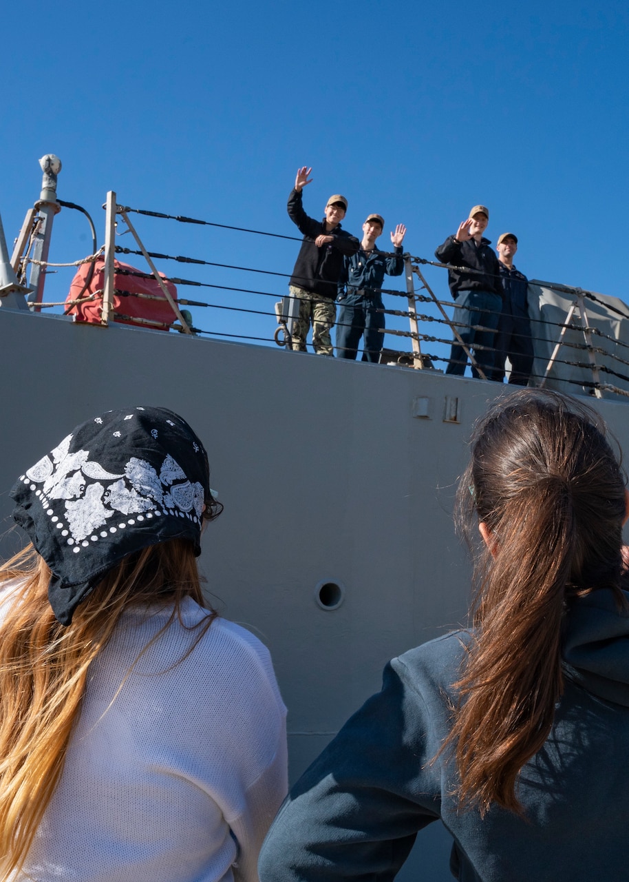 Families of Sailors assigned to the Arleigh Burke-Class guided missile destroyer, USS McFaul (DDG 74), watch as the ship prepares to depart Naval Station Norfolk for deployment, May, 2, 2023.