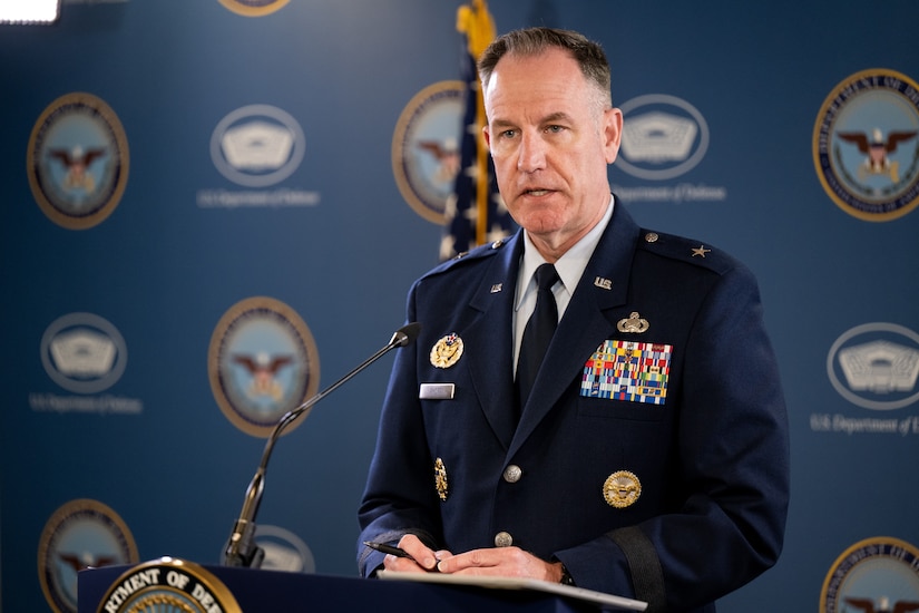 A man speaks from a podium.