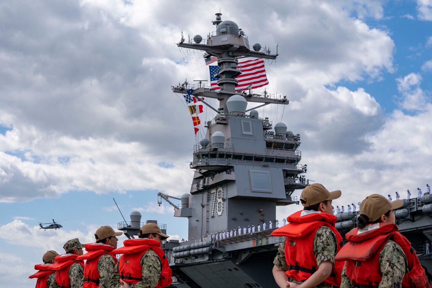 Line handlers stand by as the capital ship of the Gerald R. Ford Carrier Strike Group (GRFCSG), the first-in-class aircraft carrier USS Gerald R. Ford (CVN 78), departs Naval Station Norfolk for a routine deployment, May 2.