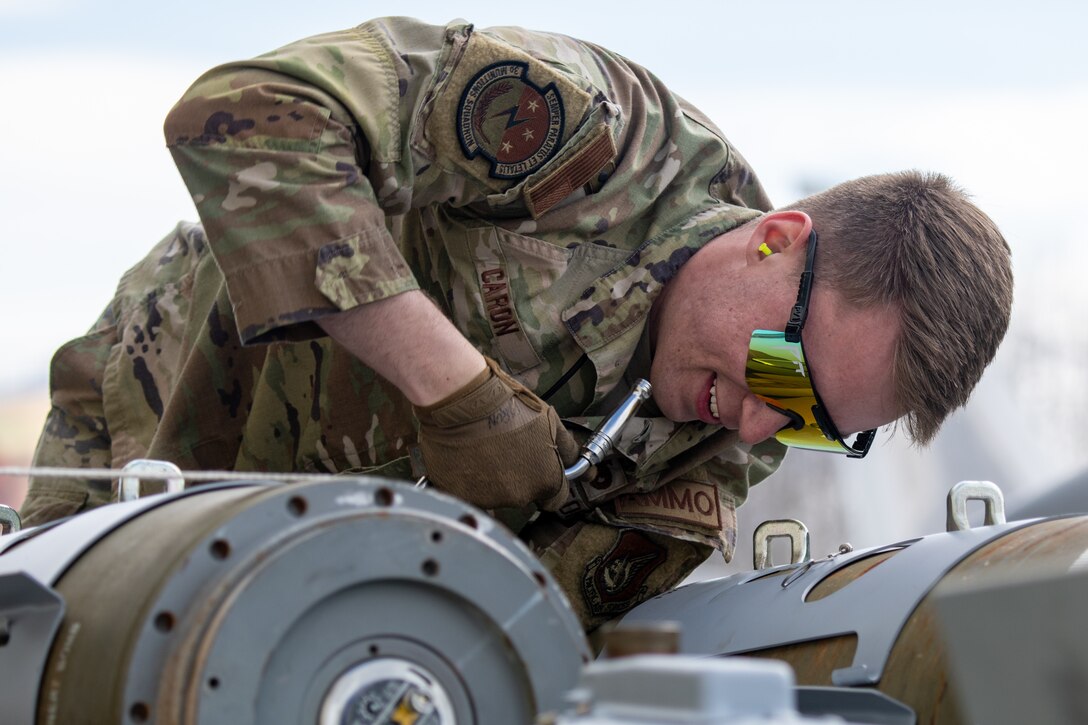 A photo of an Airman building a bomb