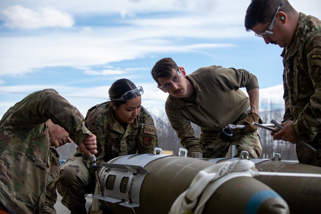 A photo of Airmen building a bomb