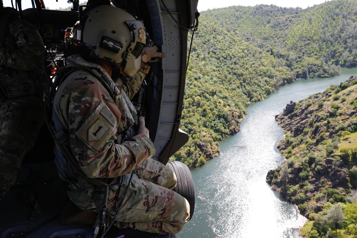 U.S. Army Staff Sgt. Jacob Sorensen, crew chief, Golf Company, 2nd Battalion, 211th General Support Aviation Battalion, Utah National Guard, on an HH-60M Black Hawk helicopter during annual wildland firefighting training in Sacramento, Calif., April 22, 2023. California, Utah, Nevada and Wisconsin National Guard members participated in the training with CAL FIRE.