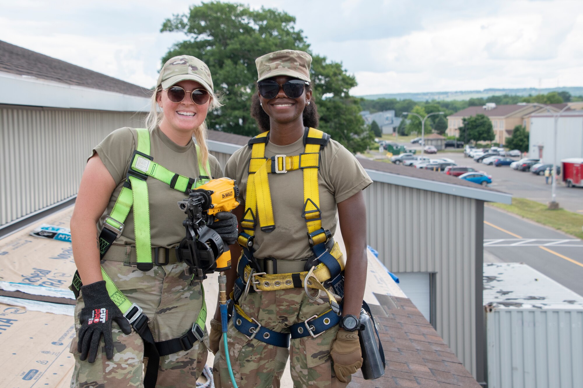 From left, Senior Airman Mary O. Bransford, 131st Civil Engineer Squadron (CES) operations management journeyman and Airman 1st Class Kerris S. Eady, 131st CES operations management apprentice, pose for a photo while resurfacing a roof at 14 Wing Royal Canadian Air Force Base in Greenwood, Canada, July 14, 2022. Members with the 131st Bomb Wing’s 231st CES, 200th REDHORSE Squadron and the 239th Combat Communications Squadron, deployed to Nova Scotia as part of the Construction Engineering Project Exchange Program with the 14 Wing of the RCAF. These Guard members worked in cooperation with the RCAF to complete quality of life improvements to the base, to build on skillsets and to strengthen interoperability with Canadian allies. (U.S. Air National Guard photo by Airman 1st Class Kelly C. Ferguson)