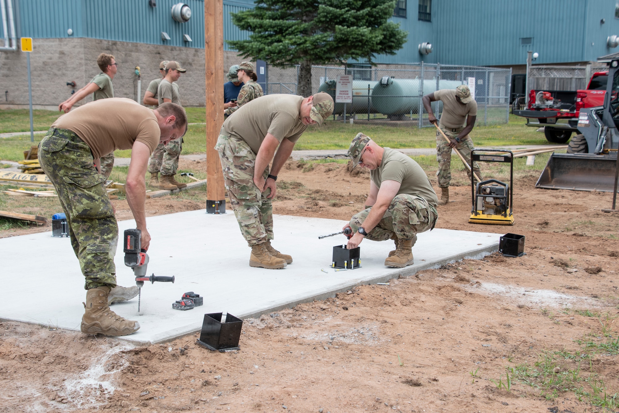 U.S. Air National Guard members with the 131st Bomb Wing and members of the Royal Canadian Air Force (RCAF), work in teams to complete various projects at 14 Wing Royal Canadian Air Force Base in Greenwood, Canada, July 19, 2022. Members with the 131st Bomb Wing’s 231st Civil Engineer Squadron, 200th REDHORSE Squadron and the 239th Combat Communications Squadron, deployed to Nova Scotia as part of the Construction Engineering Project Exchange Program with the 14 Wing of the RCAF. These Guard members worked in cooperation with the RCAF to complete quality of life improvements to the base, to build on skillsets and to strengthen interoperability with Canadian allies. (U.S. Air National Guard photo by Airman 1st Class Kelly C. Ferguson)