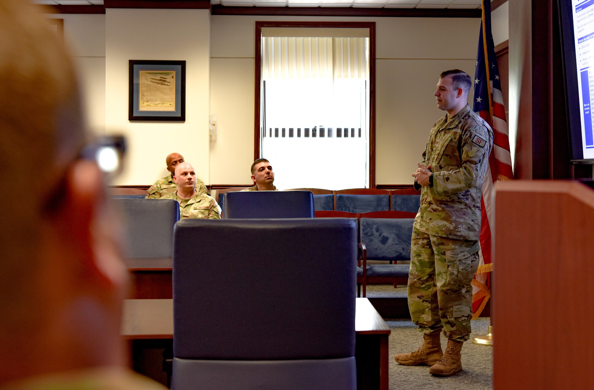 U.S. Air Force Tech. Sgt. Christopher Colton, 647th Security Forces Squadron NCOIC training, awaits questions from the judges during the inaugural 15th Wing Spark Tank competition on Joint Base Pearl Harbor-Hickam, Hawaii, April 28, 2023.