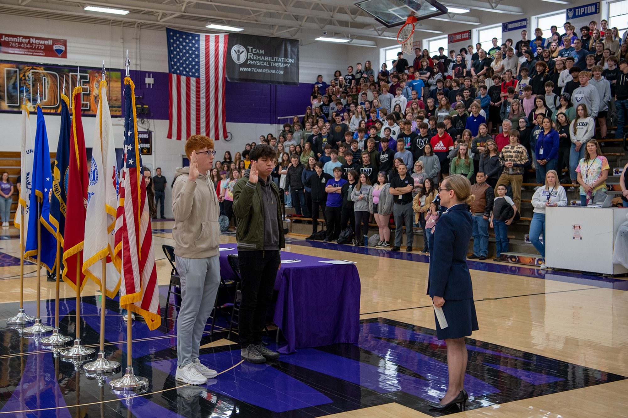 Col. Arianne Mayberry, 434th Maintenance Group commander, administers the oath of enlistment to Northwestern High School Students who decided to join the military. Schools from both Peru and Kokomo held events to recognize the next generation of citizen warriors. (U.S. Air Force photo/TSgt. Jami Lancette)