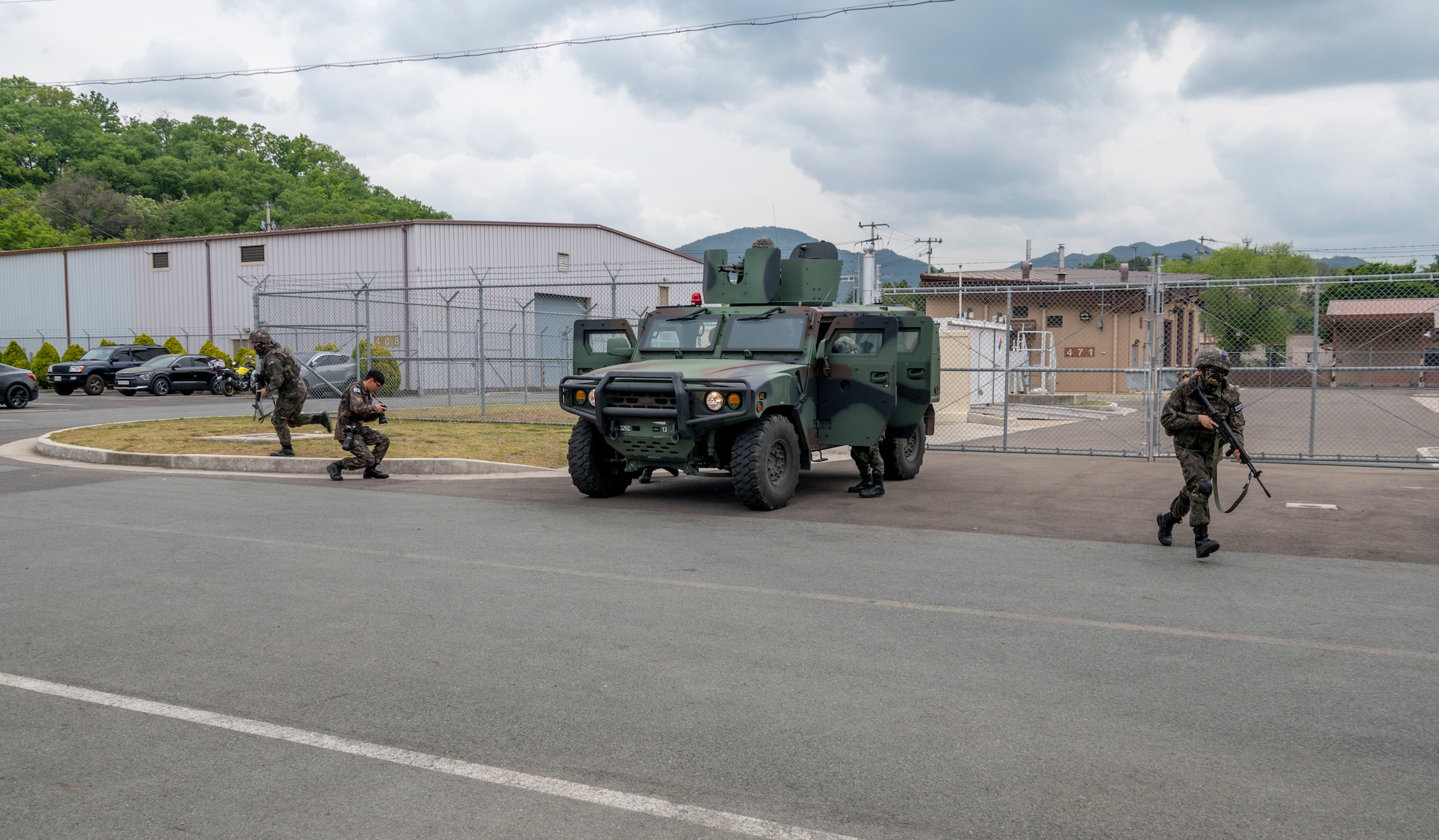 Republic of Korea Air Force military police members move into position during an active shooter training event at Daegu Air Base, ROK, April 24, 2023. This event was the first force protection and wartime transition training held this year, with plans for training every quarter. (U.S. Air Force photo by Airman 1st Class Aaron Edwards)