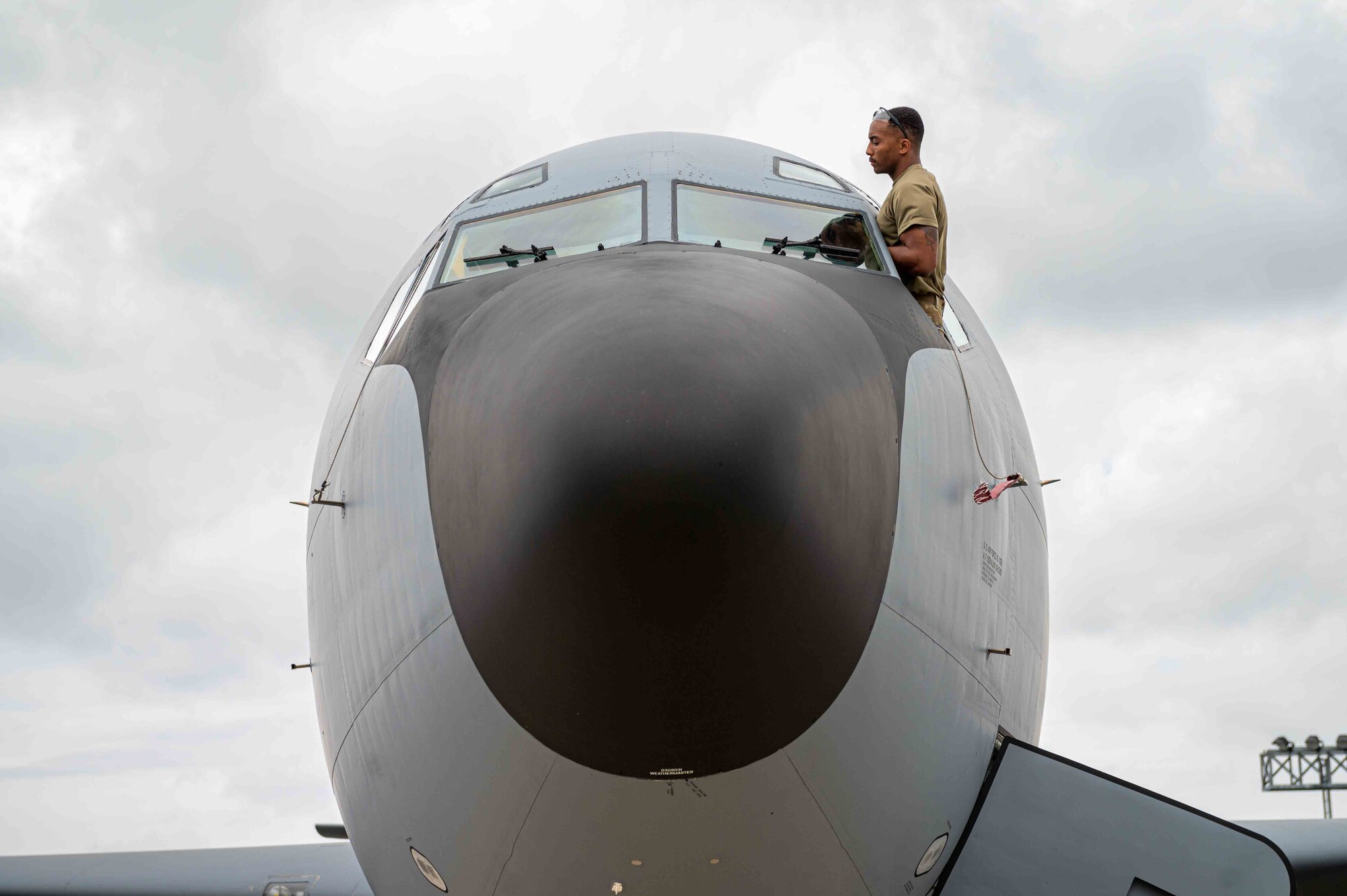 Airman inspects a aircraft window