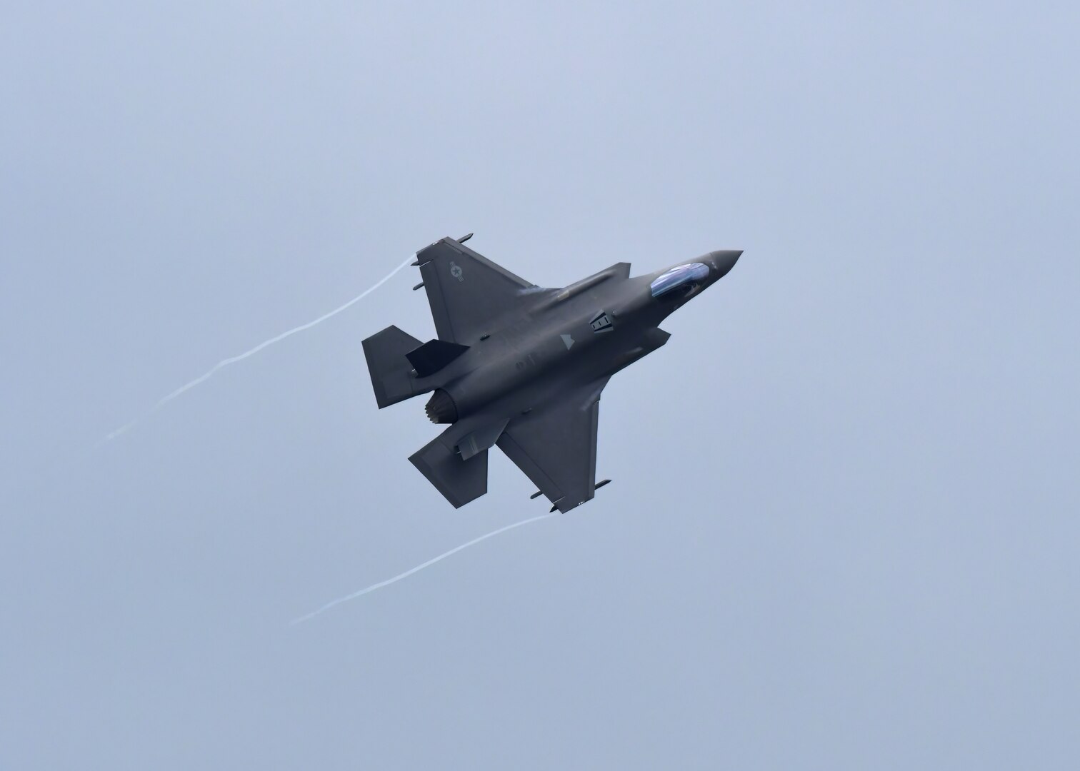 The first of three F-35A Lightning II aircraft assigned to the Wisconsin Air National Guard's 115th Fighter Wing overflies Dane County Regional Airport in Madison, Wisconsin