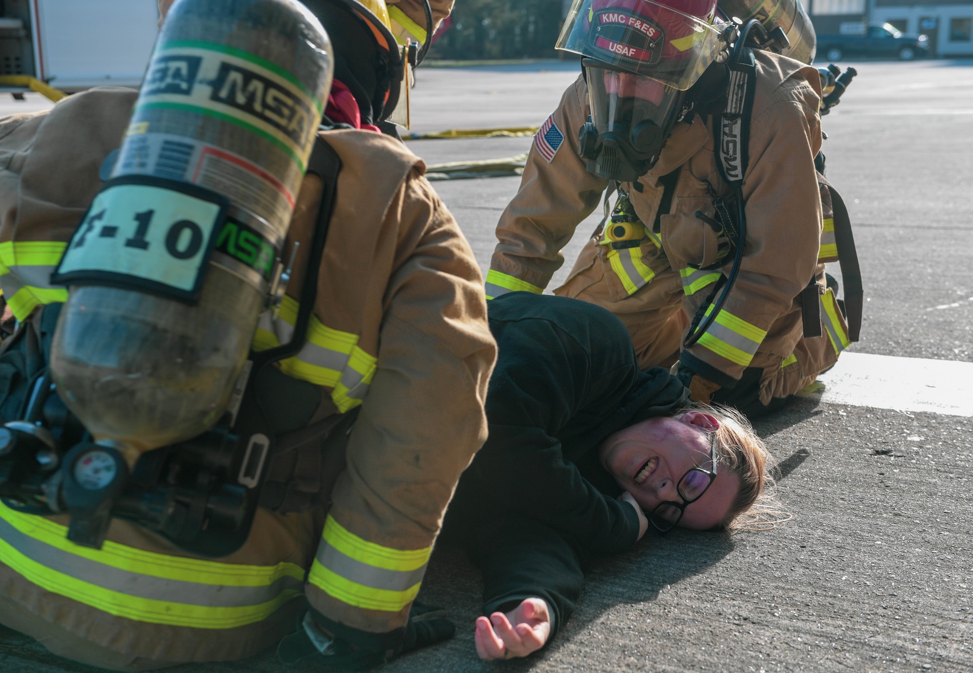Kaiserslautern Military Community Fire and Emergency Services firefighters provide emergency care to a volunteer at Ramstein Air Base, Germany, April 27, 2023. Exercise Ready Eagle II simulated an explosion at a hangar to test the skills of 86th Medical Group personnel and first responders, increasing preparedness for a variety of emergency scenarios.