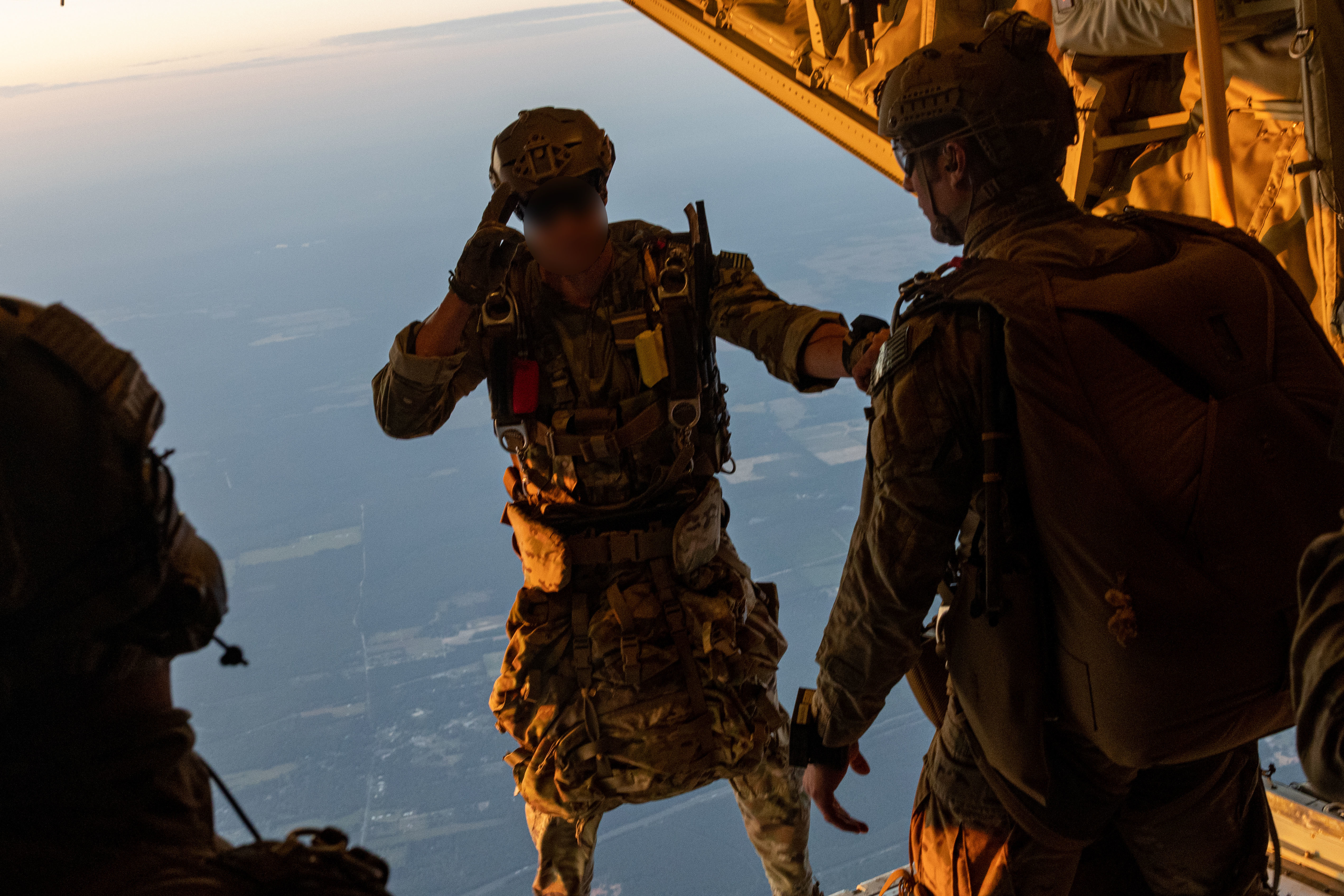 Special Tactics Airmen jump from a Marine Corps KC-130J Hercules