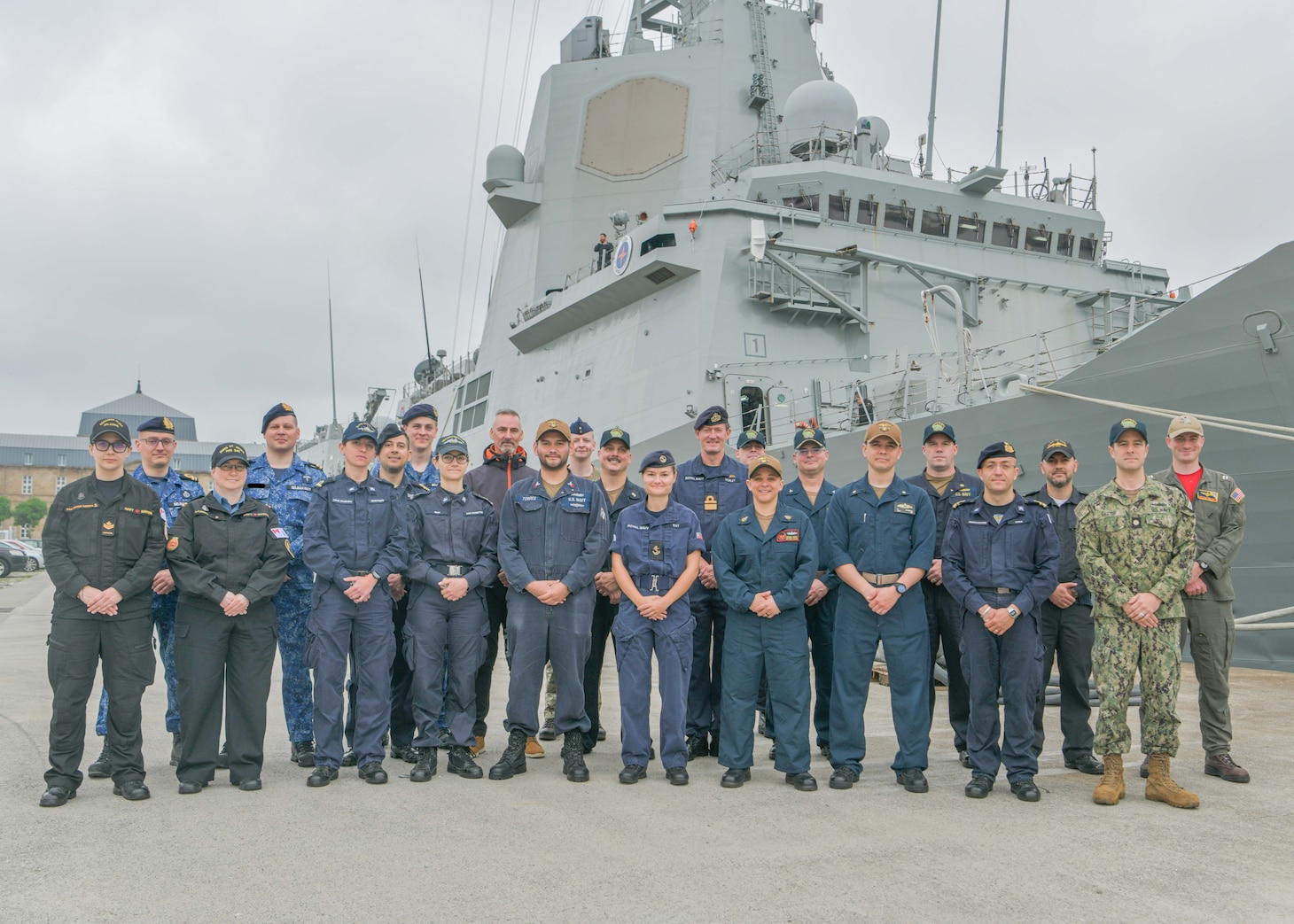 The multinational Commander, Task Group (CTG) Integrated Air and Missile Defense (IAMD) staff embarked aboard Spanish Navy Álvaro de Bazán-class frigate ESPS Blas de Lezo (F-103) in support of exercise Formidable Shield pose for a photo on the pier in Ferrol, Spain, April 28, 2023. Formidable Shield is a biennial exercise involving a series of live-fire events against subsonic, supersonic, and ballistic targets, incorporating multiple Allied ships, aircraft, and ground forces working across battlespaces to deliver effects.