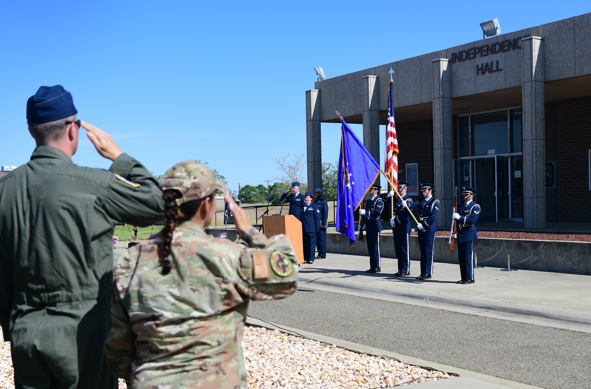 Airmen salute the U.S. Flag during the presentation of colors at the Independence 08 10th anniversary memorial ceremony on Beale Air Force Base, California, on April 27, 2023.