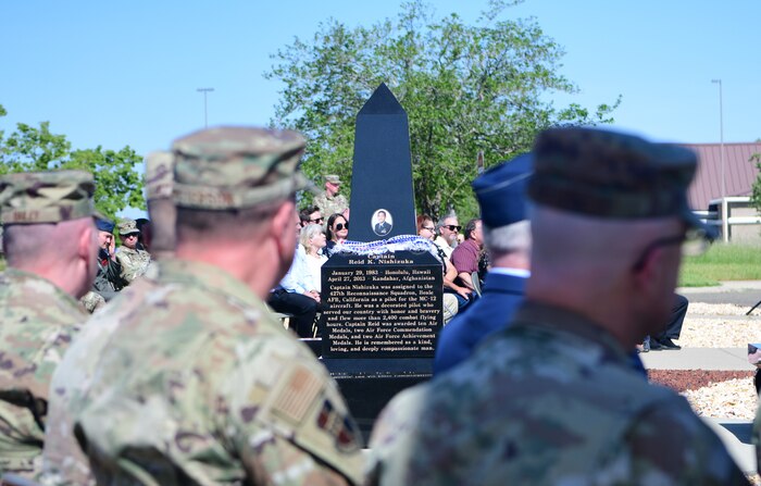 Service members and family members of the fallen Airmen from the Indy 08 crash attend the 10th anniversary memorial ceremony of the crash at the Independence Theater on Beale Air Force Base, California, on April 27, 2023.
