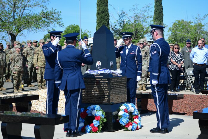 Beale honor guardsmen salute the Independence 08 memorial during the wreath presentation at the Independence Theater on Beale Air Force Base, California, on April 27, 2023.