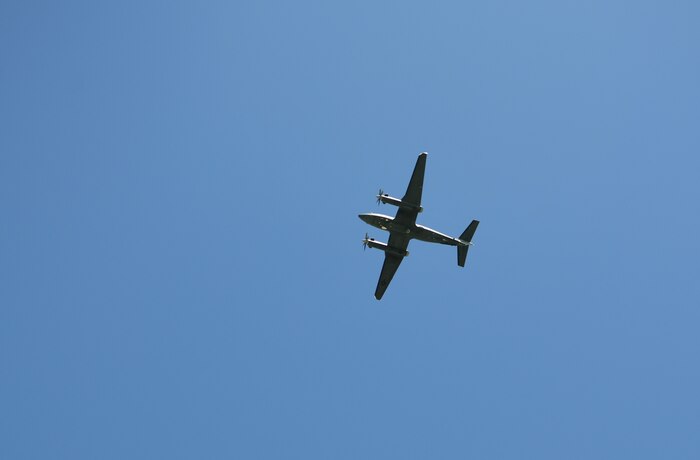 An MC-12 Liberty conducts a flyover during the Indy 08 memorial ceremony at Beale Air Force Base, California, on April 27, 2023.