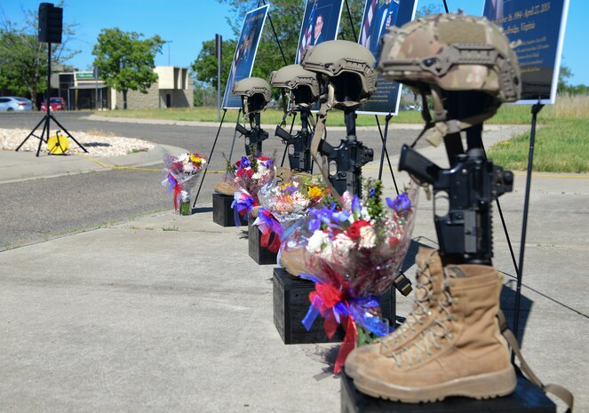 Four battlefield crosses are displayed during the Indy 08 memorial ceremony at the Independence Theater on Beale Air Force Base, California, on April 27, 2023.