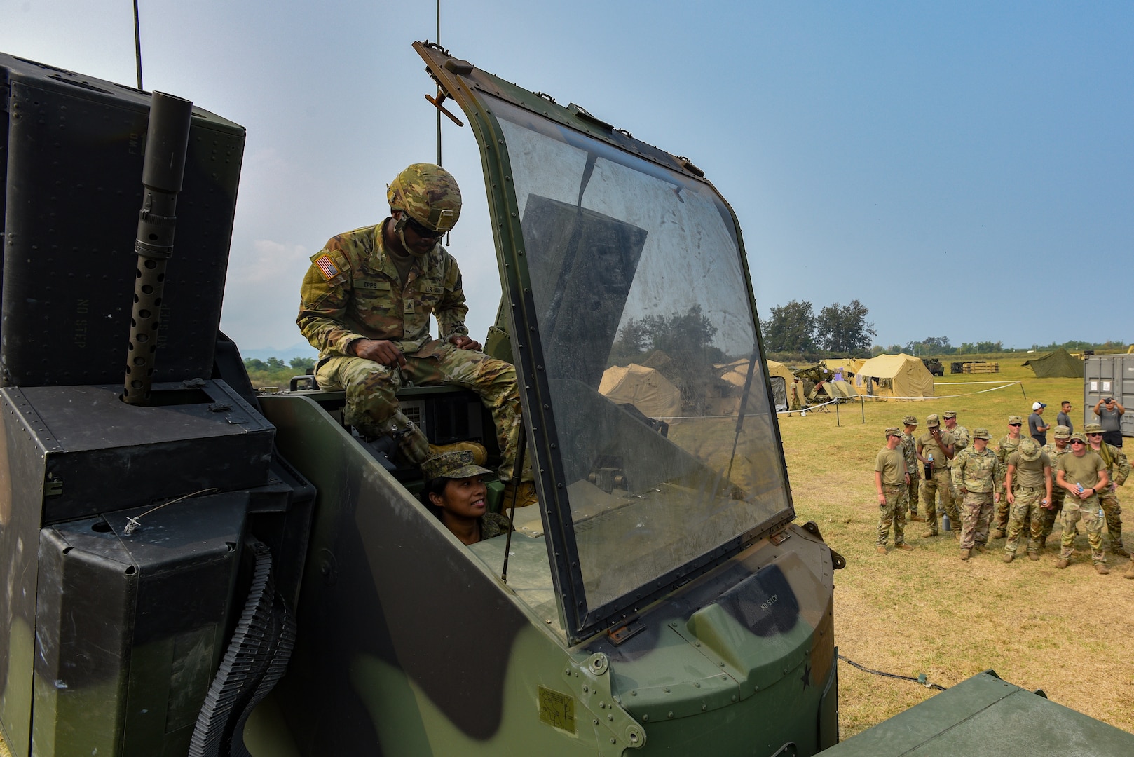 U.S. Army Sgt. Andre Epps, an Avenger Air Defense System crew member with the Mississippi Army National Guard’s 1st Battalion, 204th Air Defense Artillery Regiment, facilitates an Avenger Air Defense System demonstration while a member of the Philippine Army controls the turret in San Narciso, Philippines, April 22, 2023. Guard members participated in Exercise Balikatan 2023, the 38th iteration of the annual bilateral exercise between the Armed Forces of the Philippines and American counterparts.