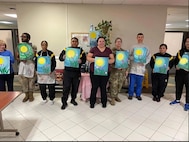 (Photo courtesy Teresa Kramer) Soldiers and Cadre paint on canvas at an art class at the Fort Drum SRU