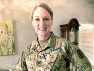 Col Theresa Lewis shows her socks with a nod to fighting breast cancer.