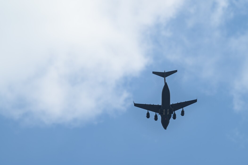 A C-17 Globemaster III aircraft assigned to the 911th Airlift Wing, Pittsburgh, flies over Youngstown Air Reserve Station, Ohio on April 25, 2023.