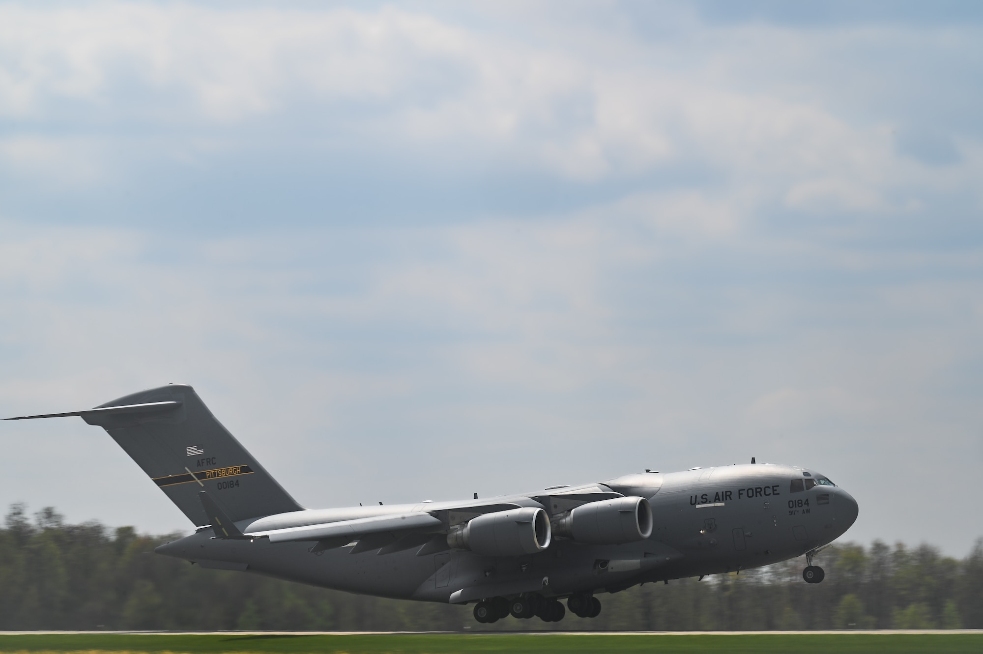 A C-17 Globemaster III aircraft assigned to the 911th Airlift Wing, Pittsburgh, takes off at Youngstown Air Reserve Station, Ohio on April 25, 2023.