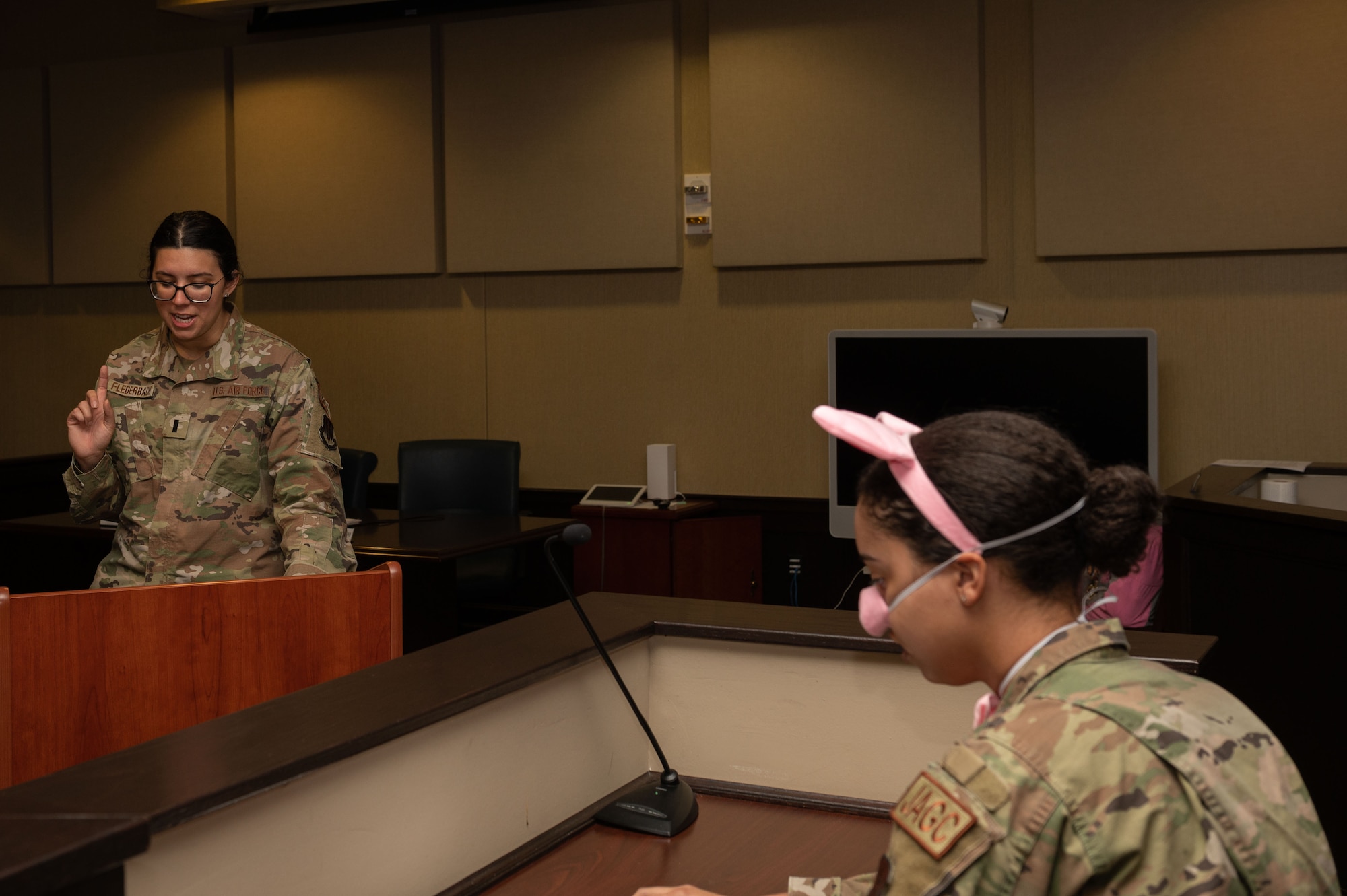 1st Lt. Carmen Flederbach, 4th Fighter Wing Judge Advocate chief discharge, cross examines Capt. Baylee McLeod, 4th FW JA chief adverse actions, during a “Big Bad Wolf” fairy tale themed mock trial at Seymour Johnson Air Force Base, North Carolina, May 1, 2023. Cross examination is when an opposing party asks questions a witness during a trial. The base invited students from Carver Heights Elementary School, Goldsboro, North Carolina, as part of Law Day, to teach them about Air Force’s legal profession. Community outreach events help the wing build relations with local communities and is an opportunity for Airmen to mentor future leaders.  (U.S. Air Force photo by Airman 1st Class Rebecca Sirimarco-Lang)